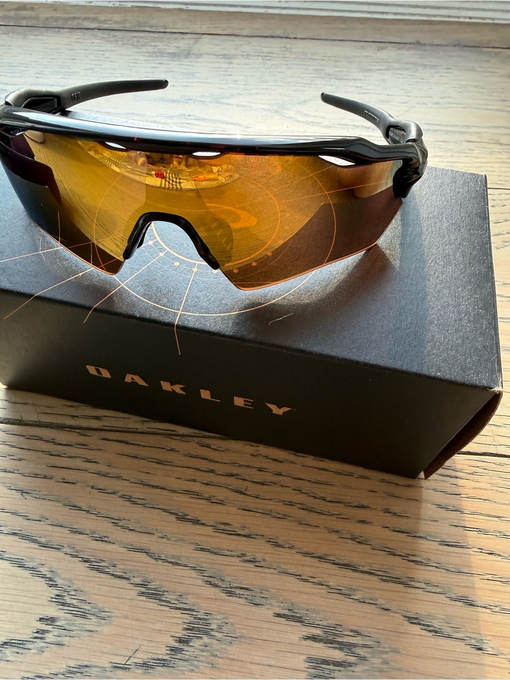 Oakley Black Frame Sunglasses with Amber Mirror Lens